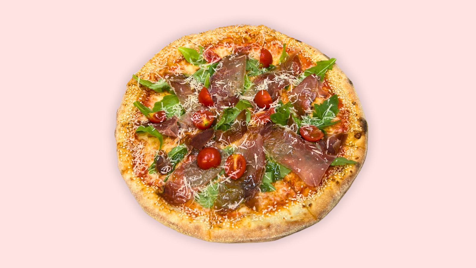 Krudo pizza topped with prosciutto crudo, rocket, cherry tomatoes and parmesan